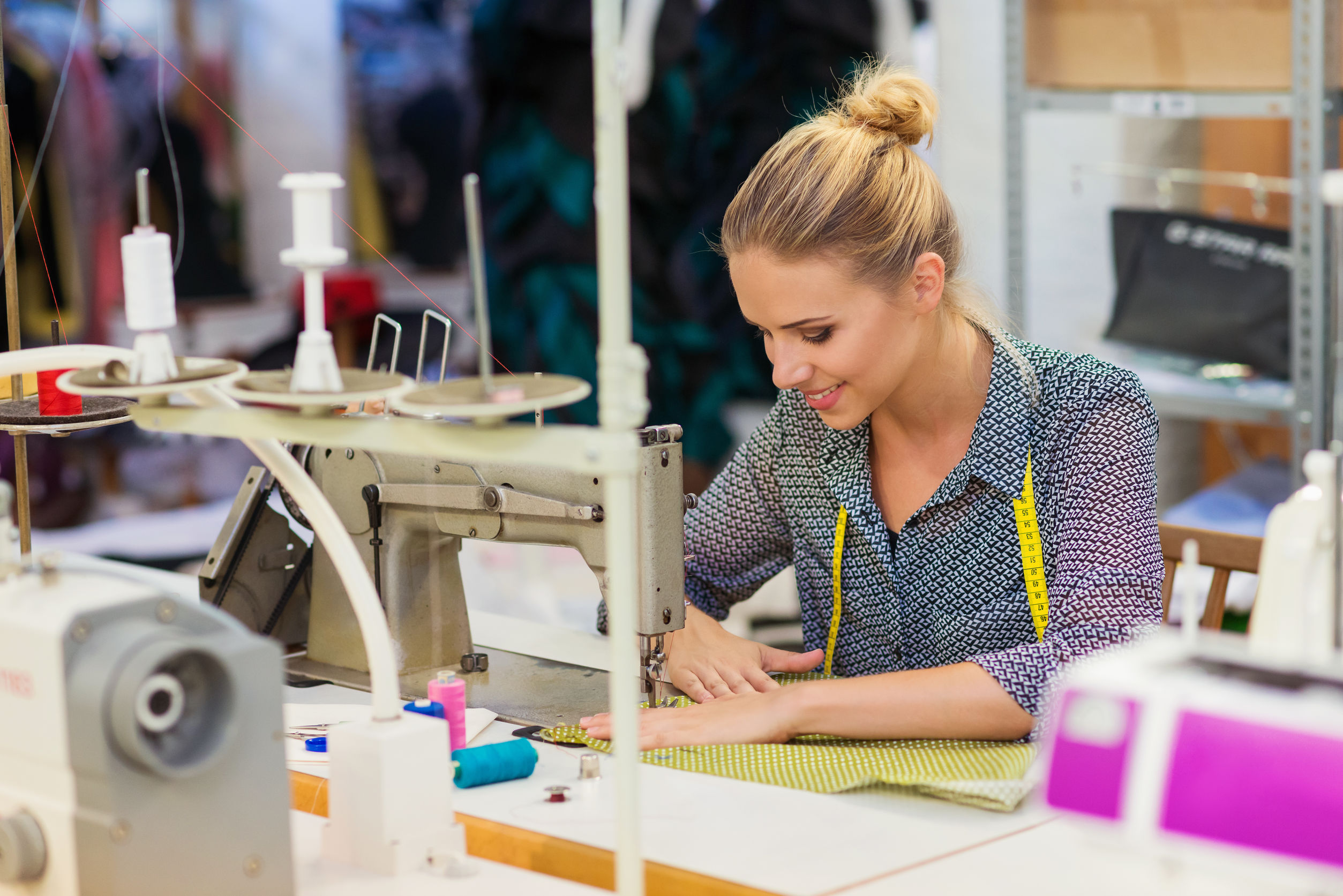 Young woman with sewing machine